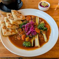 Spiced lentils casserole with potato bread and extra pickles. 22 June 2025. at Grain of the Silos in Invermay