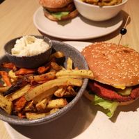 Signature burger w fries/Aiolinaise (front) and Supreme burger w fries/ketchup (back) at Copper Branch in Utrecht