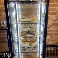 Pies in the fridge. I recognize the chocolate cake and mango cheesecake by Holtkamp. They’re delicious!  at Copper Branch in Utrecht