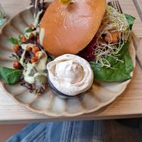 Portobellissimo Burger —
Brioche bun with roasted 
portobello, sweet potato, sweet 
onion jam, alfalfa, ‘cheddar’, 
lettuce and aioli at Copper Branch in Utrecht