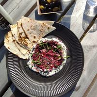 Flatbread, beetroot hummus, vegan mayo, Nigella seeds. at Sono Matseljur in Reykjavik