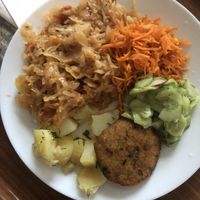 Warm cabbage, potatoes, carrot salad, cucumber and cream salad (very typical polish summer salad) and cutlet   at Vega in Warsaw