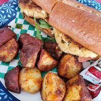Vegan Crabcake Po'boy with potatoes at Meals From The Heart Cafe in New Orleans