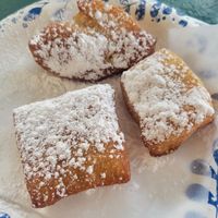 Vegan beignets (this is a dessert plate, not a dinner plate to reference size) at Meals From The Heart Cafe in New Orleans