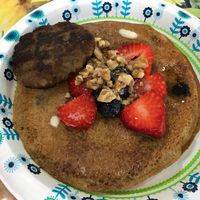 Vegan blueberry pancakes with an apple sausage party. Incredible!  at Meals From The Heart Cafe in New Orleans