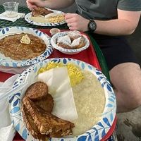 Pancakes, beignets, and breakfast combo    at Meals From The Heart Cafe in New Orleans