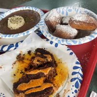 hot sausage, red beans and rice, and vegan beignets  at Meals From The Heart Cafe in New Orleans