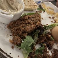 Half eaten (vegan kebab, hummus, pitta and chips with side salad)   at Steve's in Paphos