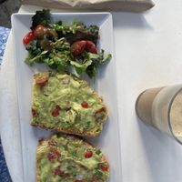 Avocado toast and latte with almond milk  at Brusco in Santorini