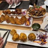 Onion fritters, okra crunch, vegetable samosas, and alu vada at House of Naan in New Haven