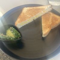Cheese toastie with some cucumber with seeds sprinkled on ( I filled this with my scramble tofu mix)   at Come Back in Naoussa