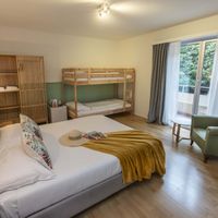 Family room with balcony at Garden Hotel Primavera in Brissago