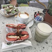Red vegan greek bagel with matcha latte, flat white with (vegetarian) green greek bagel  at Merry Berry in Thessaloniki