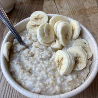 Oatmeal with bananas. Oat milk available as well as other fruits, maple syrup and nuts   at Le Pain Quotidien - 44th and 3rd in New York City