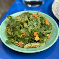 Corn tostada with Kefta spread and herb yogurt  at DAR Restaurant & Cocktail Bar in Zurich
