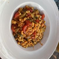 Fregola pasta with aubergine, pepper, tomato  at Mamacita Café in Sarchittu