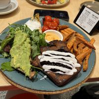 Brunch plate: omelet, choc chip banana bread, sweet potato fries, avocado toast, salad  at Shake Cafe - Via dei Neri  in Florence