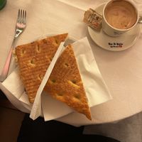 Focaccia sandwich with chickpea cream and spinach. Espresso with non-dairy milkk  at Bar Il Palio in Siena