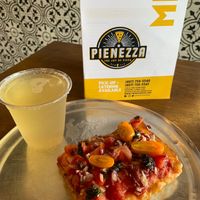 Vegan Bruschetta slice and kombucha l. at Pienezza Pizza in Kissimmee