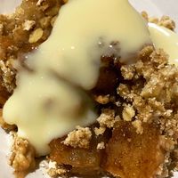 Homemade spicy Apple crumble with custard  at Greedy Vegan in Chelmsford
