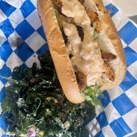 Skrimp 🍤 Po Boy with kale salad 😋  at Banu Vegan in Durham