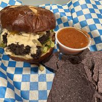 Banu burger, side of chips and salsaa  at Banu Vegan in Durham