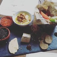Vegan board with vegan cheese (from Pistache & Cacahuète in Lille), vegan sausage, hummus and dips with veggies at La Luck in Lille