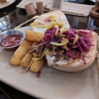 Grand Puebla open face with yucca fries at Mantra Kitchen in Houston