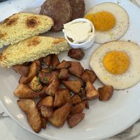 Over easy eggs, Beyond sausage, and homefries.   at Coco Bistro & Bar in Chapel Hill