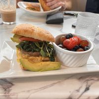 Complete breakfast sandwich, comes with fruit   at Coco Bistro & Bar in Chapel Hill