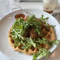 Vegan chicken (seitan) and waffles.  SO GOOD!  Vegan grilled cheese breakfast sandwich in the background.  at Coco Bistro & Bar in Chapel Hill