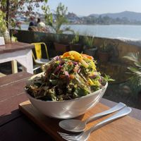 The buddha bowl with warm, delicious baked greens and homemade hummus at the buttom.   at Vegan Way in Pokhara