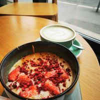 Oat meal with coconut and peanut butter; matcha tea with pea milk at Kafeterija Batutova in Belgrade