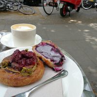 Cherry pistachio roll and a cut open blueberry cream something at KÄYK in Berlin