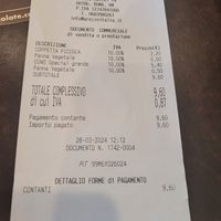 Price of small gelato in tub and large gelato in cone at Grezzo Raw Chocolate in Rome