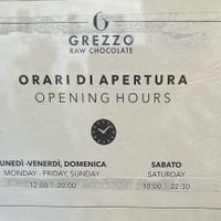 It actually opens at 12 noon every day, staff confirmed   at Grezzo Raw Chocolate in Rome