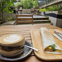 Cappucino + Wrap filled with chickpea omelette and veggies at The Planteen in Budapest