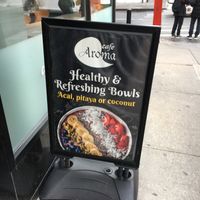 Placard outside (NB: it is not clear how many of these bowls are vegan--they don't say; makes sure to ask). at Cafe Aroma in New York City