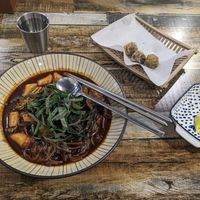 Vegan jajang noodles tteobokki (with pumpkin (squash) added) and (1 order of) glass noodles in seaweed at Cow Tteokbokki  in Seoul