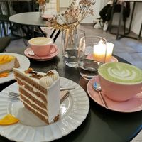 Matcha latte, flat white, vanilla Chai cake. at Sakura in Berlin