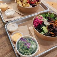 Mushroom schwarma bowl & cauliflower bowl w/ side of kale salad, plenty of sauce! at Shouk in Rockville