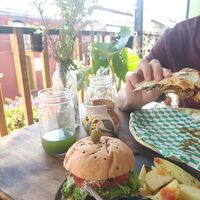 Burger and Tlayuda at Los Muchitos Comida Vegana in Oaxaca