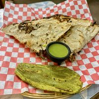 Tlayuda with pastor  at Los Muchitos Comida Vegana in Oaxaca