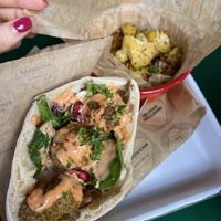 Pita with falafel, vegan dressing, roasted cauliflower side  at Barouche in Ghent