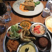 Thali in front and artichoke caponata with potato pave in back  at Mallow - Borough Market in South East London