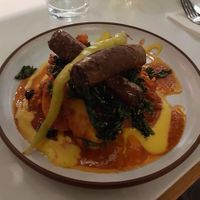 Sausages on Persian cauliflower and potatoes, with kale and apricot harissa   at Mallow - Borough Market in South East London