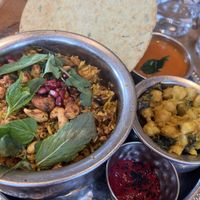 thali, pomegranate jackfruit pulihora, devilled cashews, kaju makhani, winter green chana sabzi, herb chutney, methi cracker, beetroot raita  at Mallow - Borough Market in South East London