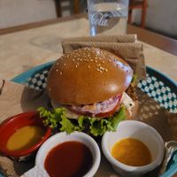 juicy burger with sauces at Bien Plantado in Iquitos