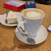 latte and cheesecake  (did have a raspberry on top but was already stolen by a toddler!) at World Peace Cafe in Leicester