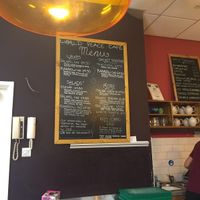Clearly labelled vegan (vg) items on fully vegetarian menu at World Peace Cafe in Leicester